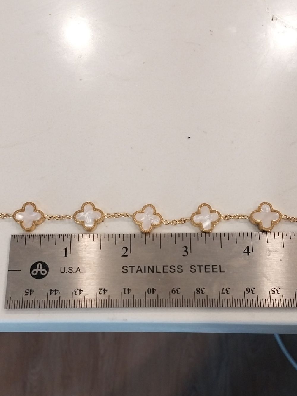 White Clover Bracelet On Stainless Steel Chain.